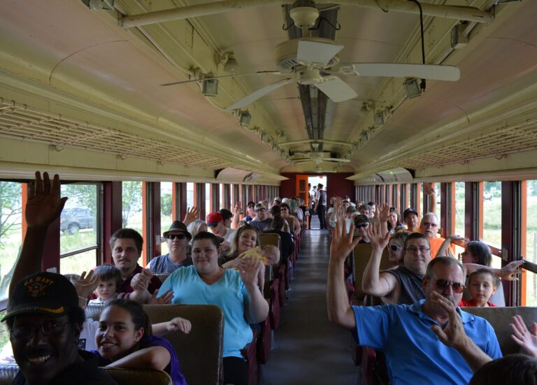 arcadeandatticarailroad_tour-train-passengers-waving-interior Arcadeandatticarailroad Tour Train Passengers Waving Interior