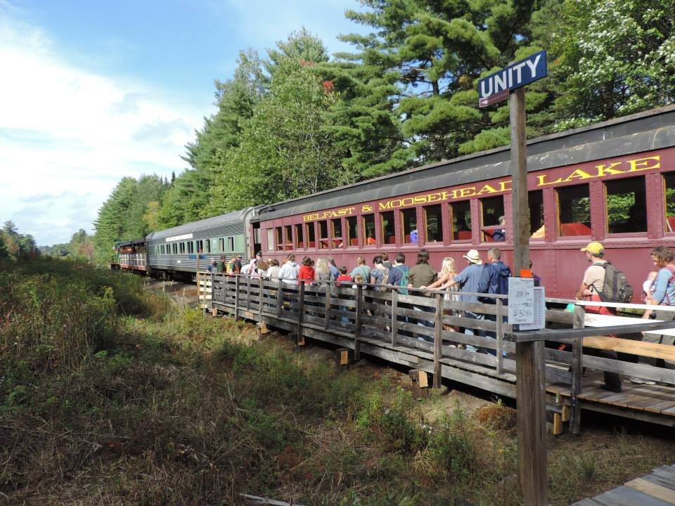 belfastandmooseheadlakerail_tour-train-passengers-boarding-wooden-platform Belfastandmooseheadlakerail Tour Train Passengers Boarding Wooden Platform