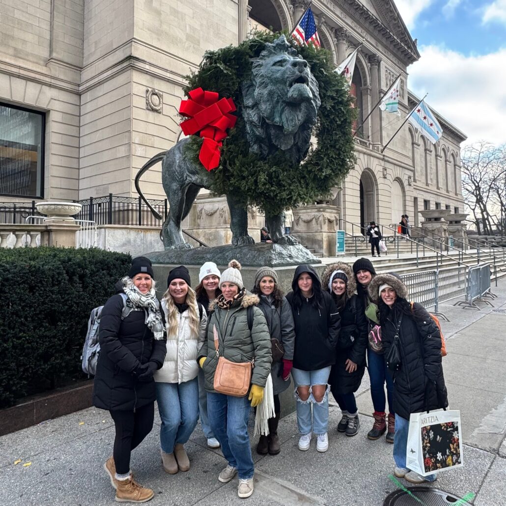 Bobbysbikehike Tour Lion Statue Wreath Group Photo