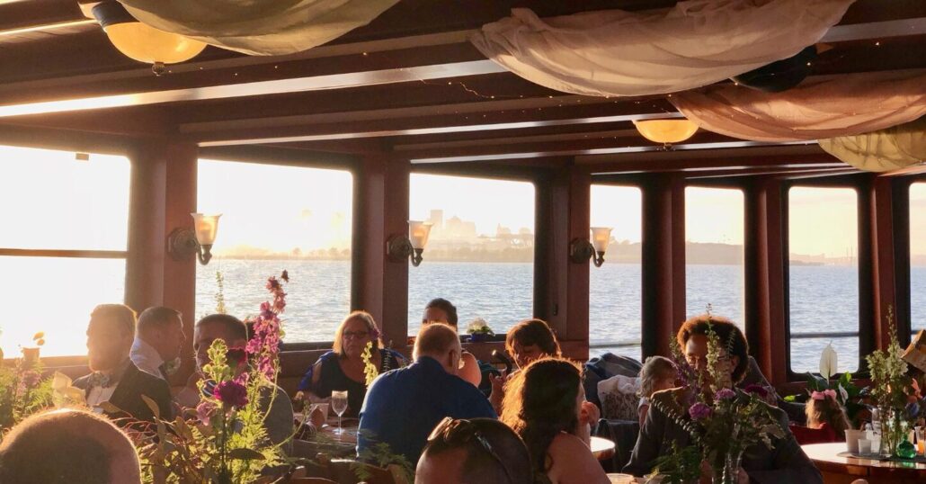 Boston Sailing Tour Dinner Cruise People Flowers Sunset