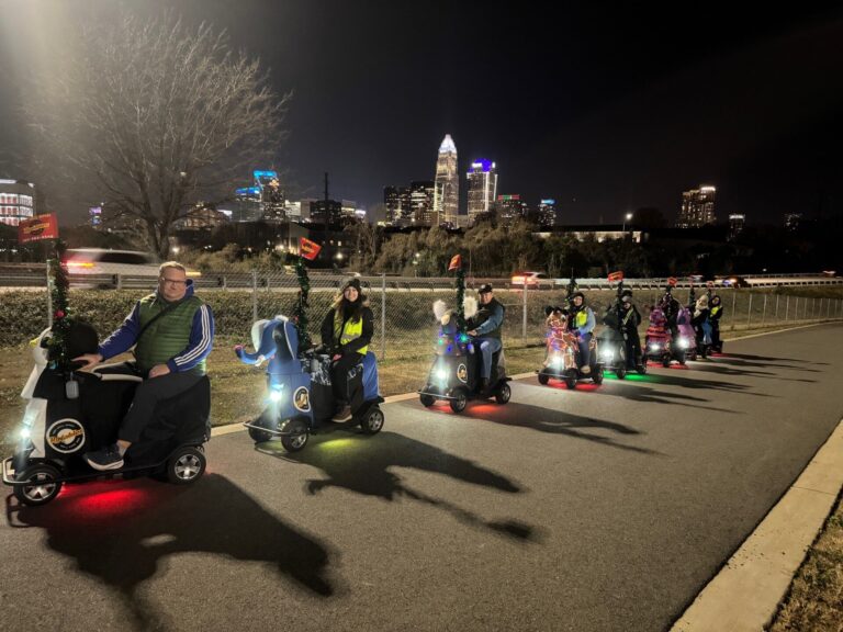 charlottenctours_tour-night-riders-scooters-cityscape Charlottenctours Tour Night Riders Scooters Cityscape