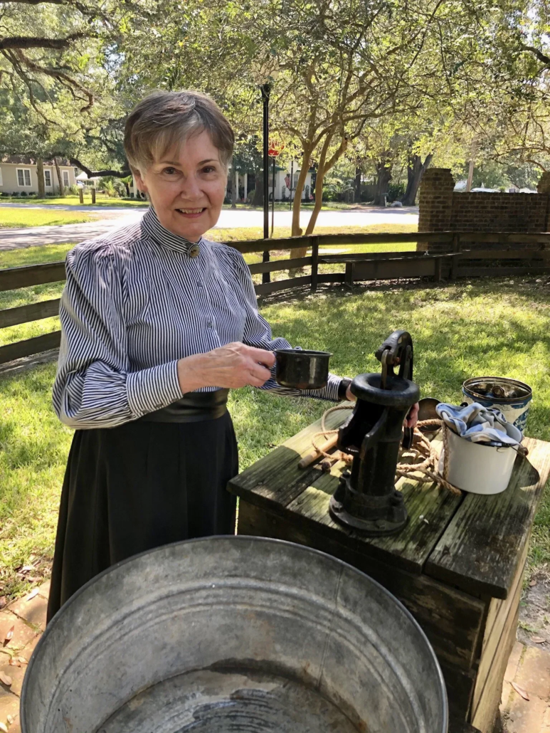 leaguecityhistory_tour-woman-holding-cup-water-pump Leaguecityhistory Tour Woman Holding Cup Water Pump