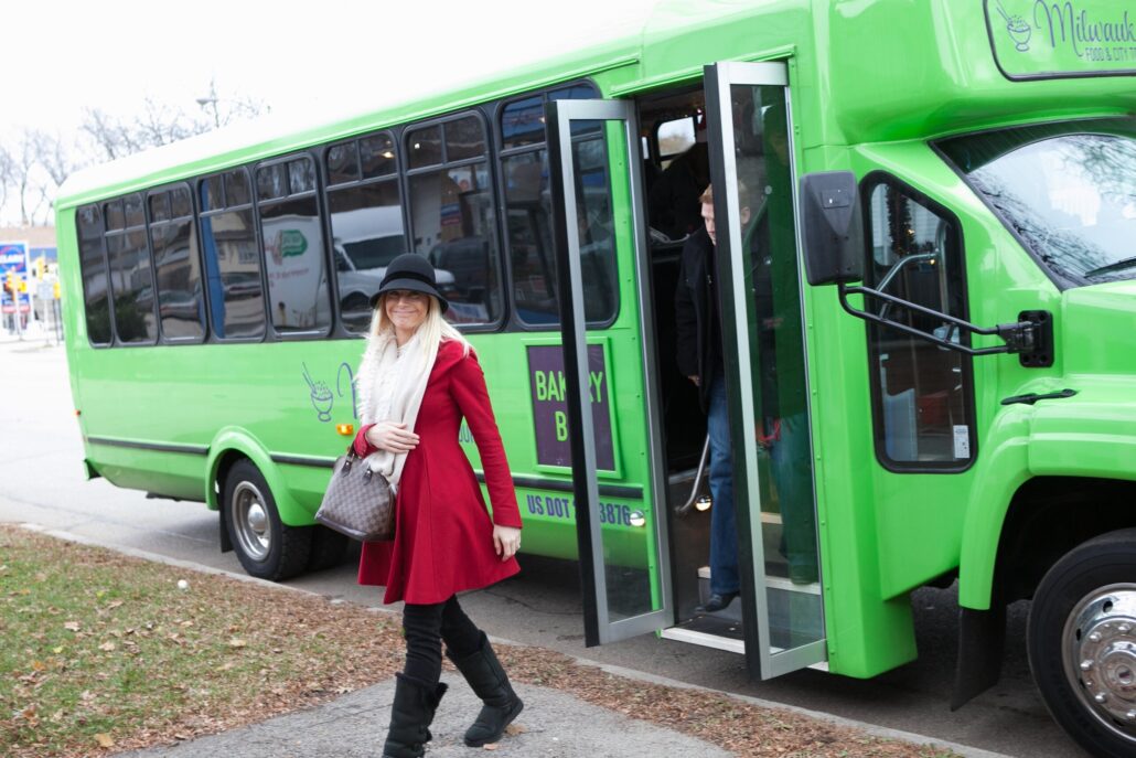 Milwaukeecitytours Tour Woman Red Coat Green Bus