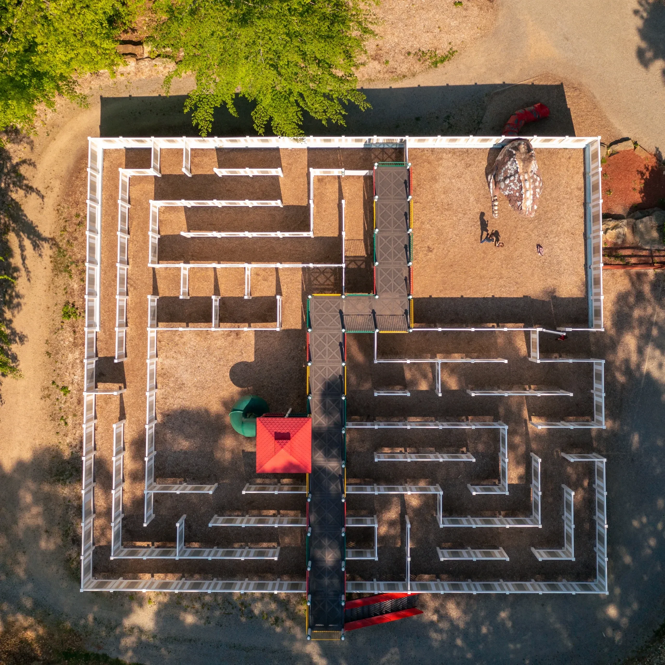 naturesartvillage_tour-playground-maze-red-roof Naturesartvillage Tour Playground Maze Red Roof