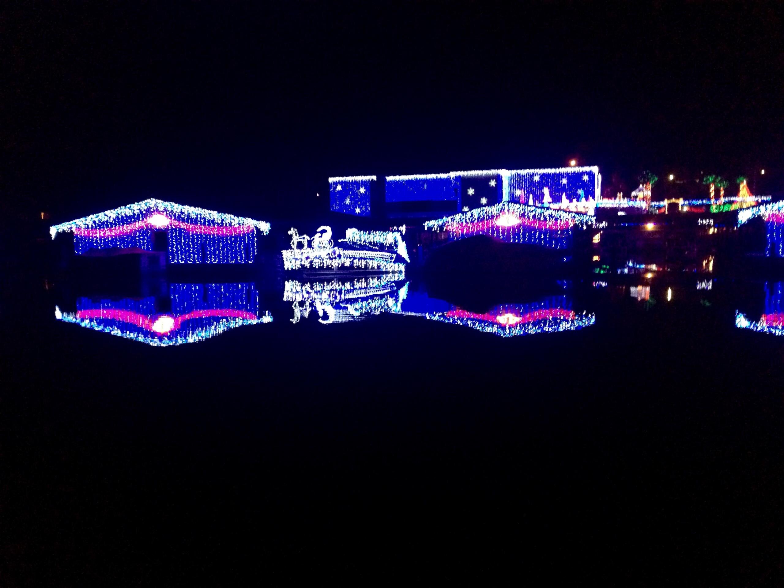 rustyanchormountdora_tour-decorated-houses-water-reflection-lights Rustyanchormountdora Tour Decorated Houses Water Reflection Lights