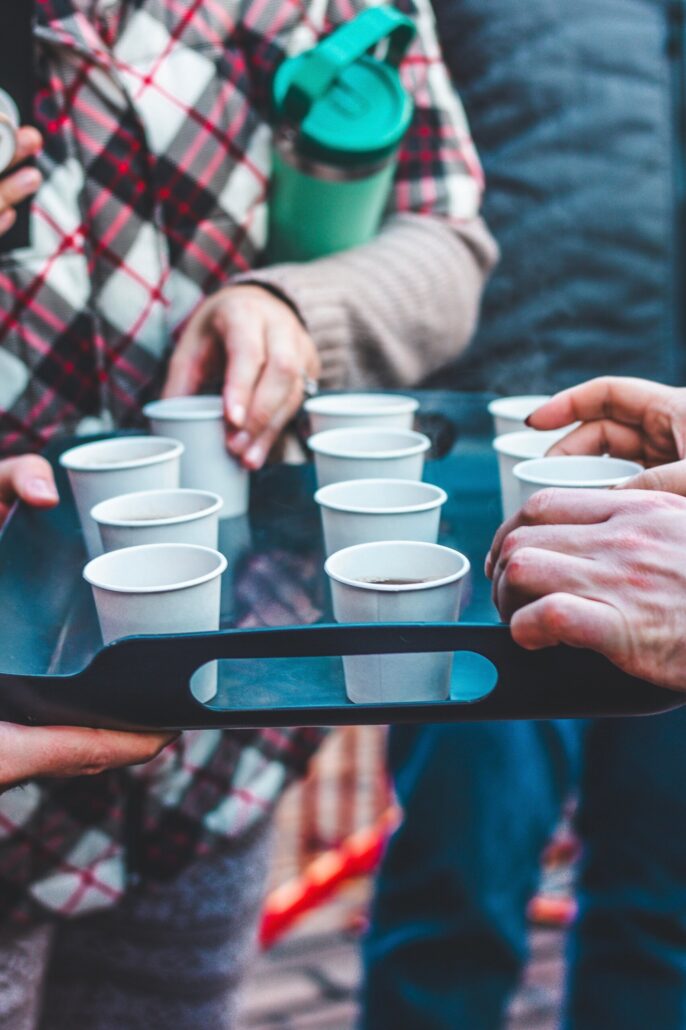 savor-seattle-tours_tour-paper-cups-tray-hands Savor Seattle Tours Tour Paper Cups Tray Hands