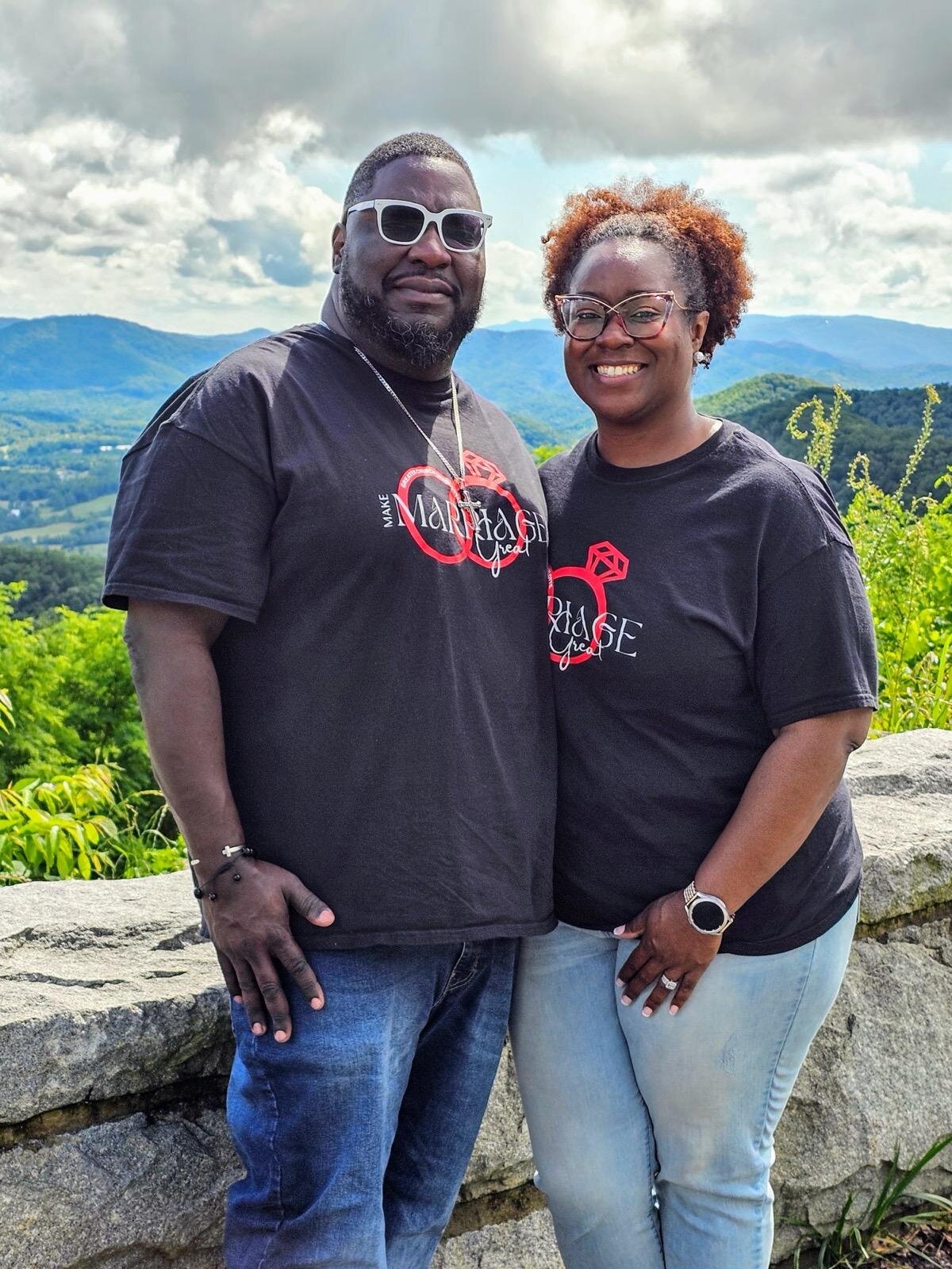 Smokybearshuttle Tour Couple Smiling Mountains Background