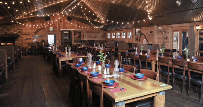 snowedinnsleigh_tour-rustic-dining-room-wooden-tables-string-lights Snowedinnsleigh Tour Rustic Dining Room Wooden Tables String Lights