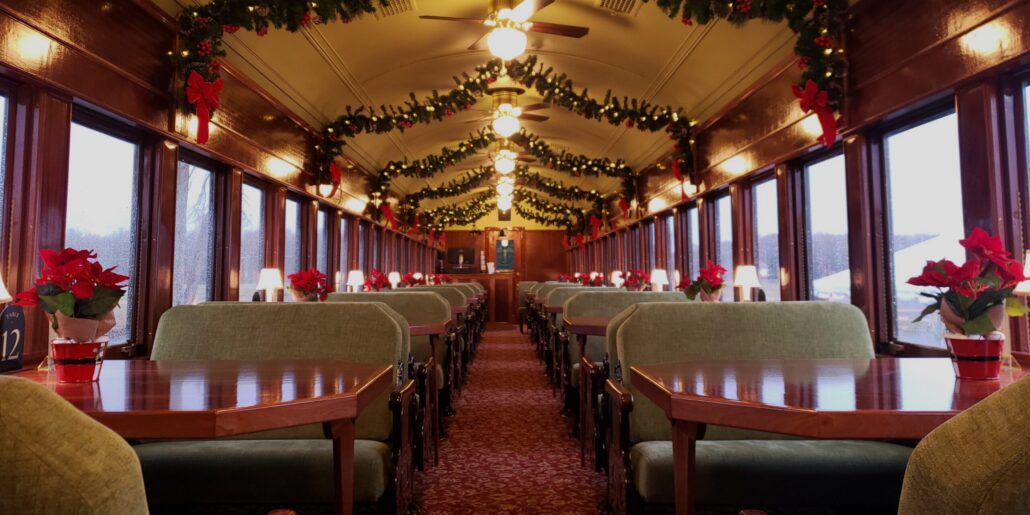 Woodstowncentral Tour Train Car Decorated Holiday Poinsettias